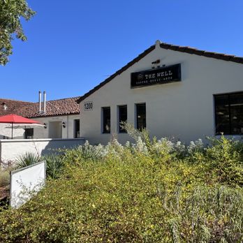 The Well - a white building with a red umbrella - Coffee & Tea Near Me - Stockton, California The Well - a white building with a red umbrella - Coffee & Tea Near Me - Stockton, California