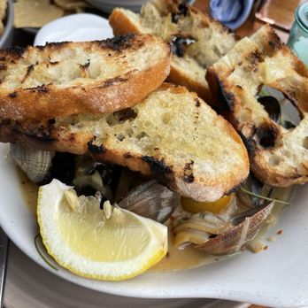 Monarch Ocean Pub - Mussels and clams. Had about 5 mussels and 10 clams? The sauce with the bread was really good. - Gastropubs Near Me - Del Mar, California Monarch Ocean Pub - Mussels and clams. Had about 5 mussels and 10 clams? The sauce with the bread was really good. - Gastropubs Near Me - Del Mar, California