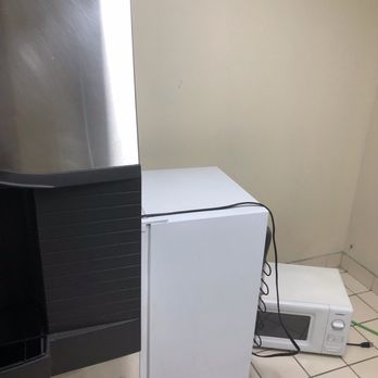 Baymont by Wyndham Kitty Hawk Outer Banks - Ice machine with microwave and refrigerator strewn on floor. - Hotels Near Me - Kitty Hawk, North Carolina