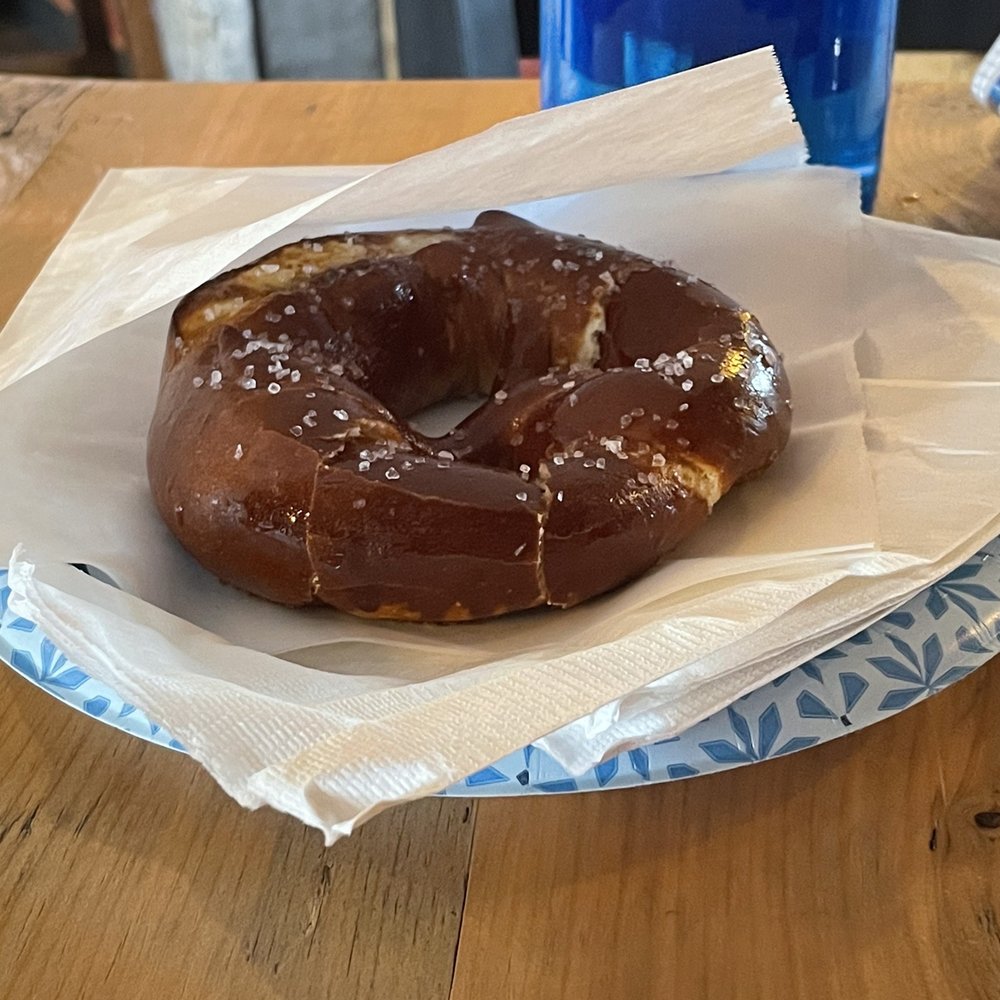 Hudson Valley Distillers - a chocolate donut on a paper plate - Distilleries Near Me - Clermont, New York