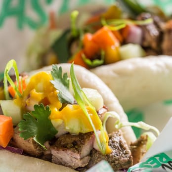 Heritage Eats - Jamaican Bao: Jamaican Jerk Chicken on two steamed bao buns with crunchy cabbage slaw, Asian pickle & pineapple habanero sauce. - Salad Near Me - Napa, California Heritage Eats - Jamaican Bao: Jamaican Jerk Chicken on two steamed bao buns with crunchy cabbage slaw, Asian pickle & pineapple habanero sauce. - Salad Near Me - Napa, California