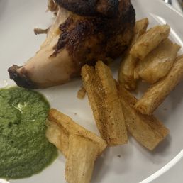 1/4 (chicken) Pollo a la Brasa with yuca fritas (fried) and hot green salsa, Cuarto de Pollo 1/4 (chicken) Pollo a la Brasa with yuca fritas (fried) and hot green salsa, Cuarto de Pollo