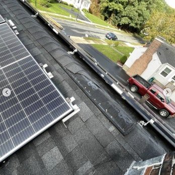 Oakridge Resolutions - solar panels on the roof of a house - Solar Installation Near Me Oakridge Resolutions - solar panels on the roof of a house - Solar Installation Near Me