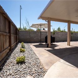 Picture Perfect Lawn - Aluminum covered patio and pavers with complete landscaping #riverrock #plants #dripline #drainage