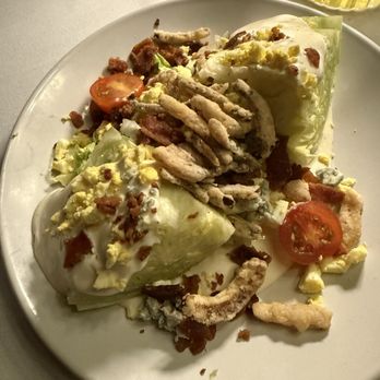 Birdie Bar - Pauly's Wedge (split): iceberg lettuce wedge, cherry tomatoes, crumbled egg, blue cheese, crispy shallots, buttermilk dressing - Cocktail Bars Near Me - Northport, New York Birdie Bar - Pauly's Wedge (split): iceberg lettuce wedge, cherry tomatoes, crumbled egg, blue cheese, crispy shallots, buttermilk dressing - Cocktail Bars Near Me - Northport, New York