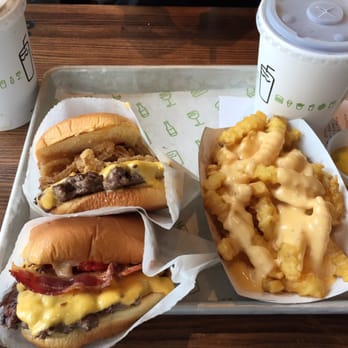 Shake Shack Buckhead - Smokeshack burger, shack meister, cheese fries, and reg size drink that looks like happy meal kid's drink - Burgers Near Me - Atlanta, Georgia Shake Shack Buckhead - Smokeshack burger, shack meister, cheese fries, and reg size drink that looks like happy meal kid's drink - Burgers Near Me - Atlanta, Georgia