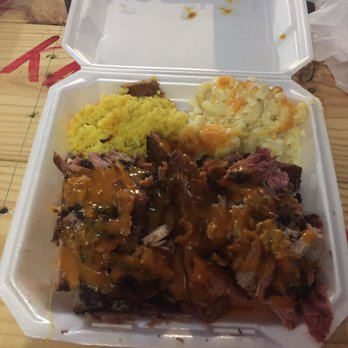 Konan BBQ - Three meat plate: sausage, pork, and ribs with mac and cheese and rice a la trigg - Barbeque Near Me - Tampa, Florida Konan BBQ - Three meat plate: sausage, pork, and ribs with mac and cheese and rice a la trigg - Barbeque Near Me - Tampa, Florida