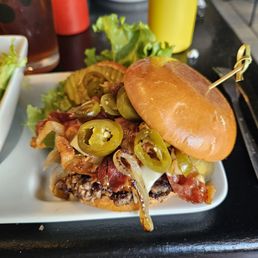 Bacon jalapeño burger with cheese and grilled onion.