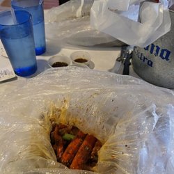 Crab It Your Way - Snow crab legs peeking out.