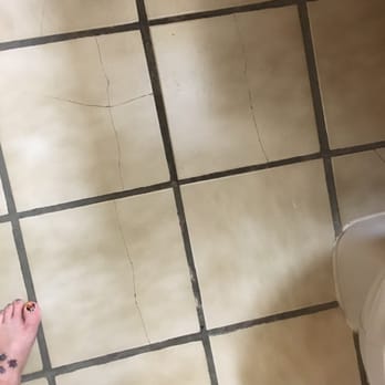 Days Inn by Wyndham Torrington - Cracked tiles all around the bathroom. The toilet needs to be remounted. The tiles are sharp and a you could cut your feet. - Hotels Near Me - Torrington, Connecticut