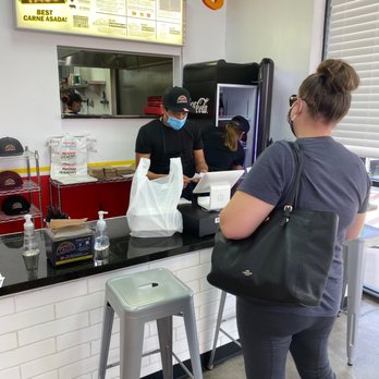 Midnight Taco - Cashier and his rest help Customer - Street Vendors Near Me - Gilbert, Arizona