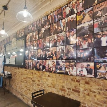 Champion Pizza - a wall full of photos of the event - Pizza Near Me - Astoria, New York