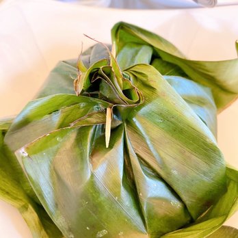 Baan Siam - Spicy chicken in banana leaf - before pulling it open - Thai Near Me - Washington, DC, District of Columbia Baan Siam - Spicy chicken in banana leaf - before pulling it open - Thai Near Me - Washington, DC, District of Columbia