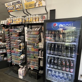 Heretic Games - Paints and soda machine between the door and counter. - Hobby Shops Near Me - San Bruno, California