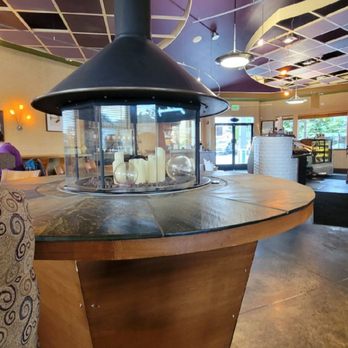 Cedar & Salt Coffeehouse - The seating area with an enclosed fire pit feature. - Coffee & Tea Near Me - Coupeville, Washington Cedar & Salt Coffeehouse - The seating area with an enclosed fire pit feature. - Coffee & Tea Near Me - Coupeville, Washington