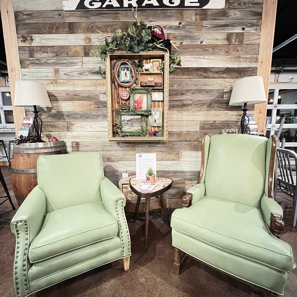 Doc’s Cellar - two green chairs in front of a wooden wall - Wine Tasting Room Near Me - Chandler, Texas Doc’s Cellar - two green chairs in front of a wooden wall - Wine Tasting Room Near Me - Chandler, Texas