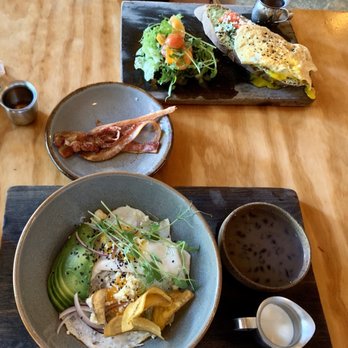 Del Cielo - Chilaquiles Verdes & Avocado Toast with Egg and Bacon on the side. - Breakfast & Brunch Near Me - Tulum, ROO Del Cielo - Chilaquiles Verdes & Avocado Toast with Egg and Bacon on the side. - Breakfast & Brunch Near Me - Tulum, ROO