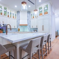 M&F Custom Cabinets - Luxury kitchen and island cabinets with top glass doors.