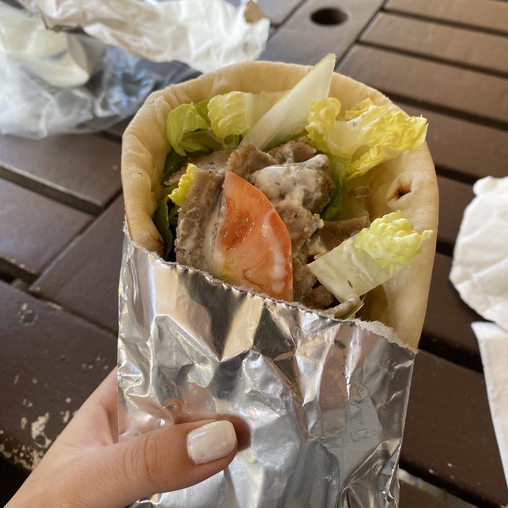 Leo's Taverna Express - a hand holding a burrito - Greek Near Me - Honolulu, Hawaii