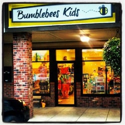 Bumblebees Kids - Store Front at night -next to Woods Coffee.
