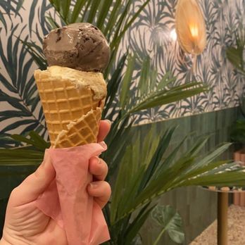Sampaguita - Banoffee Pie and Champorado scoops in a waffle cone. - Ice Cream & Frozen Yogurt Near Me - Orlando, Florida Sampaguita - Banoffee Pie and Champorado scoops in a waffle cone. - Ice Cream & Frozen Yogurt Near Me - Orlando, Florida