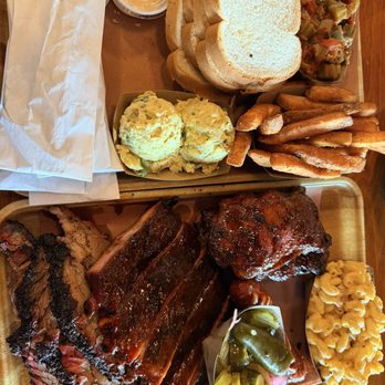 Pinkerton’s Barbeque - Upper Kirby - Brisket, glazed ribs, chicken thighs, cheddar link Tallow fries, Mac & cheese, potato salad, okra & tomatoes - Barbeque Near Me - Houston, Texas