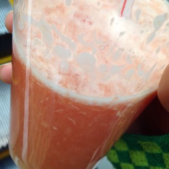 Seaside Village - a person holding a glass of orange juice - Coffee & Tea Near Me - West Vancouver, British Columbia Seaside Village - a person holding a glass of orange juice - Coffee & Tea Near Me - West Vancouver, British Columbia