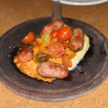Fiorito - Provoleta con chorizo . semi hard provolone cheese / sausage / tomate / basil - Argentine Near Me - Miami, Florida Fiorito - Provoleta con chorizo . semi hard provolone cheese / sausage / tomate / basil - Argentine Near Me - Miami, Florida