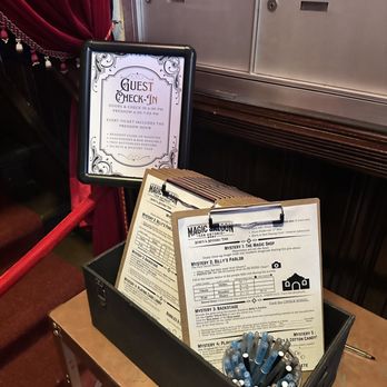 The Magic Saloon - Each group picks up a clipboard for the Secrets & Mysteries Tour, adding an interactive twist to the whole experience. - Magicians Near Me - San Antonio, Texas