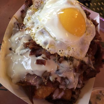 Sugarfire Smoke House - Special of the Day - Tots loaded with bacon, jack cheese sauce, brisket and an over easy egg - Barbeque Near Me - O'Fallon, Missouri Sugarfire Smoke House - Special of the Day - Tots loaded with bacon, jack cheese sauce, brisket and an over easy egg - Barbeque Near Me - O'Fallon, Missouri