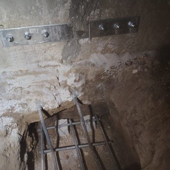 Sunshine Foundation Repairs - Epoxy and strap to fix the crack, with underpinning in progress below with rebar - General Contractors Near Me - Northridge, California