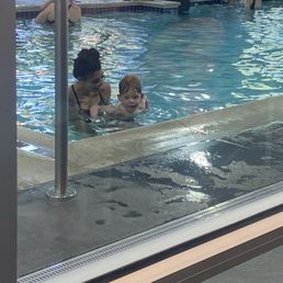 Ike Man with his swim instructor, Chey.