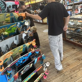 Pancho's Surf Shop - Two of my sons and my grandson walking in the front door - Sports Wear Near Me - Pismo Beach, California