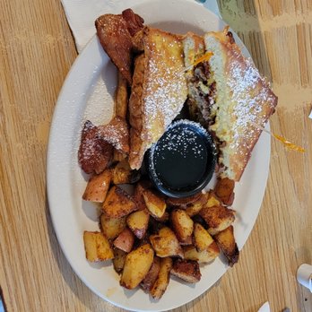Golden Harvest - This is the Bubba Sandwich - frenchtoast with sausage bacon and cheese - Breakfast & Brunch Near Me - Lansing, Michigan