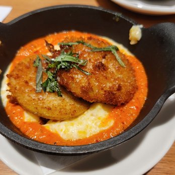 Tupelo Honey Southern Kitchen & Bar - Fried green tomatoes over grits appetizer. Excellent! - Southern Near Me - Myrtle Beach, South Carolina Tupelo Honey Southern Kitchen & Bar - Fried green tomatoes over grits appetizer. Excellent! - Southern Near Me - Myrtle Beach, South Carolina