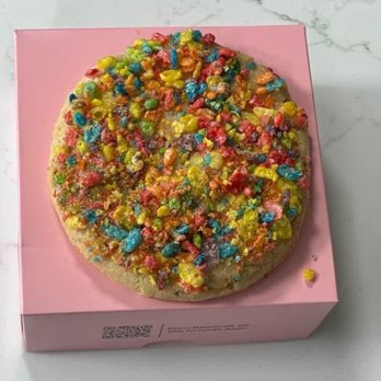 Crumbl - Spokane Valley - Cereal Milk Cookie A soft cereal-inspired sugar cookie brushed with a milky glaze and topped with vibrant, fruity cereal. - Bakeries Near Me - Spokane Valley, Washington