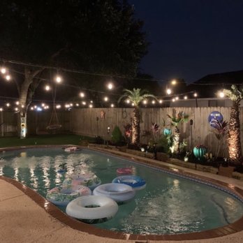 Southern Empire Landscape - Synthetic grass, our family's favorite!! Palms with landscape & beautiful lighting all by Southern Empire Landscape. - Landscaping Near Me - Houston, Texas
