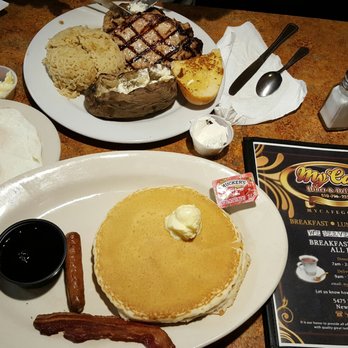 My Cafe - Boneless pork dinner with a baked potato and a Pancake Combo with ober easy eggs, bacon and sausage. Good stuff! - Breakfast & Brunch Near Me - Newark, California My Cafe - Boneless pork dinner with a baked potato and a Pancake Combo with ober easy eggs, bacon and sausage. Good stuff! - Breakfast & Brunch Near Me - Newark, California