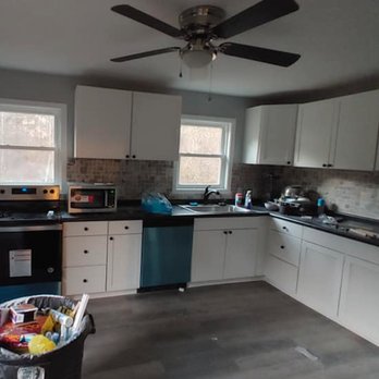Terry's Home Improvements - a kitchen with white cabinets and black counter tops - Carpenters Near Me - Broadway, North Carolina Terry's Home Improvements - a kitchen with white cabinets and black counter tops - Carpenters Near Me - Broadway, North Carolina