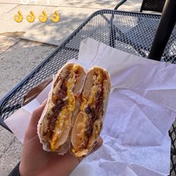 Poppy's Bagel - Bacon fried eggs cheese on everything bagel with a little bit of ketchup and mayonnaise!