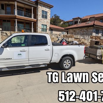 TG Lawn Services - a white truck with a trailer attached to it - Lawn Services Near Me