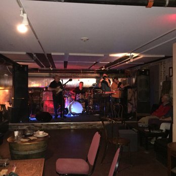 Wheelhouse - a band playing on stage in a living room - Bars Near Me - Greenfield, Massachusetts
