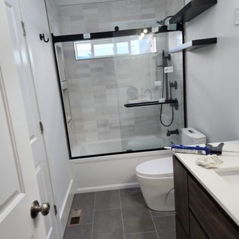 NC Construction - a bathroom with a shower and toilet - General Contractors Near Me NC Construction - a bathroom with a shower and toilet - General Contractors Near Me