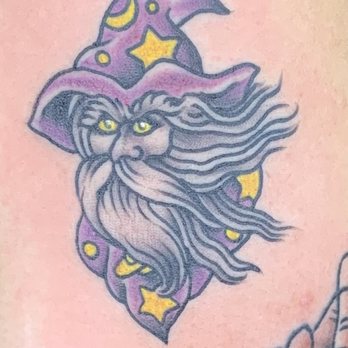 Taylor Street Tattoo - It's a purple yellow star hat wizard‍ - Tattoo Near Me - Chicago, Illinois