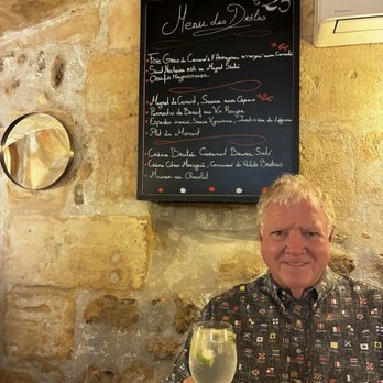 Les Drôles - Cheers from the downstairs Cave! Price Fixe menu above on chalkboard. - French Near Me - Bordeaux, 33