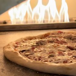 Rumi's Oasis - Custom pizza made in clay oven