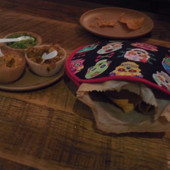 Minero - Chips and salsa -- chips are served in fabric potholder with three small salsas including a benne salsa and a verde salsa. - Mexican Near Me - Atlanta, Georgia Minero - Chips and salsa -- chips are served in fabric potholder with three small salsas including a benne salsa and a verde salsa. - Mexican Near Me - Atlanta, Georgia