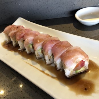 Sushi On Fire - Station 42 Roll. Salmon, Albacore, Bluefin, Avocado, soy paper, wrapped in Yellowtail... house sauce. - Sushi Bars Near Me - Long Beach, California Sushi On Fire - Station 42 Roll. Salmon, Albacore, Bluefin, Avocado, soy paper, wrapped in Yellowtail... house sauce. - Sushi Bars Near Me - Long Beach, California
