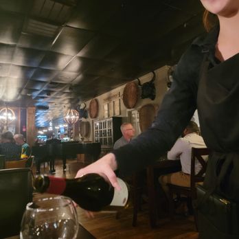 The Feed Sack - Sadie, our waitress, pouring our wine - American Near Me - Aiken, South Carolina