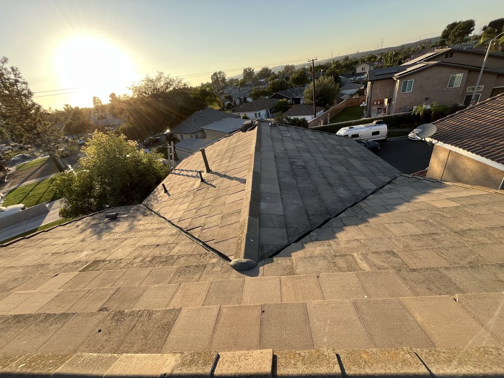 Slide of T’s Roofing 